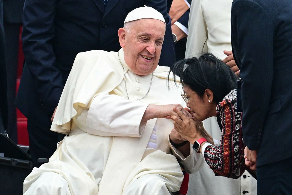 Pope Francis is welcomed during his arrival at SoekarnoHatta International Airport in Jakarta.