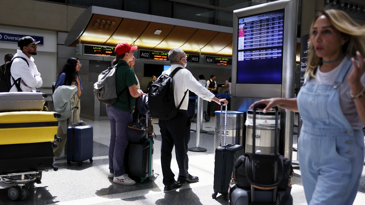 LOS ANGELES, CALIFORNIA - AUGUST 30: Travelers view the airline ticket counters board at the international terminal at Los Angeles International Airport (LAX) ahead of the Labor Day holiday on August 30, 2024 in Los Angeles, California. The Transportation Security Administration (TSA) predicts Labor Day weekend will be the busiest ever, with almost 2.9 million travelers expected to be screened in U.S. airports today. (Photo by Mario Tama/Getty Images)