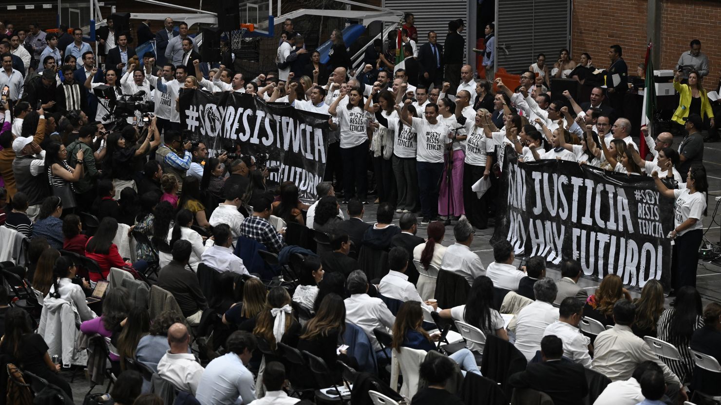 Deputies of National Action party shout slogans against the judicial reform law during a session at an alternate venue of the Mexican Congress in the Sala de Armas of Mexico City on September 3, 2024. Protesting judicial workers on Tuesday blocked access to Mexico's lower house of Congress to try to prevent a vote on controversial reforms proposed by outgoing President Andres Manuel Lopez Obrador. (Photo by Alfredo ESTRELLA / AFP) (Photo by ALFREDO ESTRELLA/AFP via Getty Images)