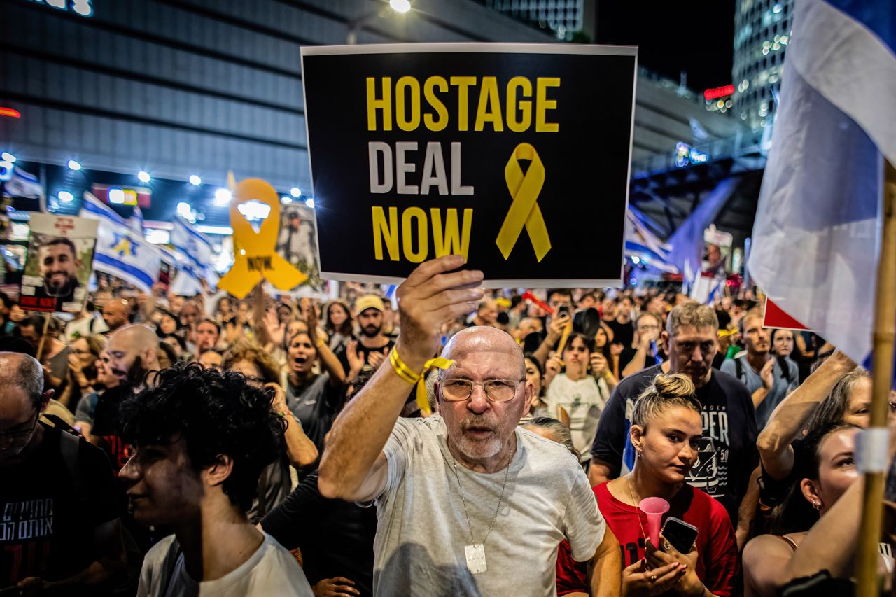 An Israeli protester holds a placard during a demonstration outside the Ministry of Defense, in Tel Aviv, Israel, on September 3.