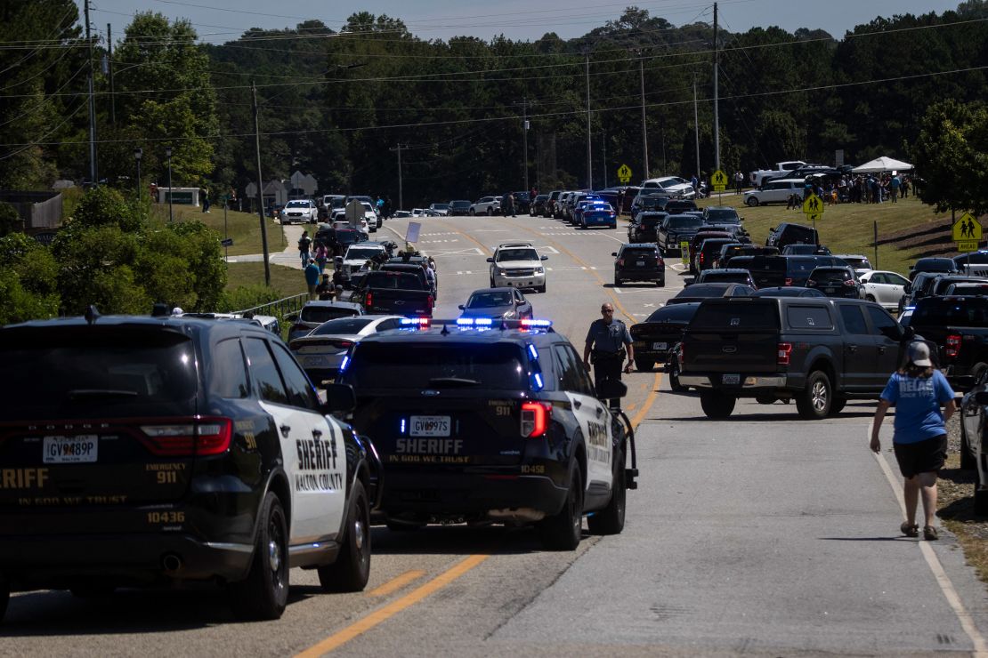 Law enforcement and emergency personnel direct traffic after a shooting at Apalachee High School in Winder, Georgia on September 4, 2024.