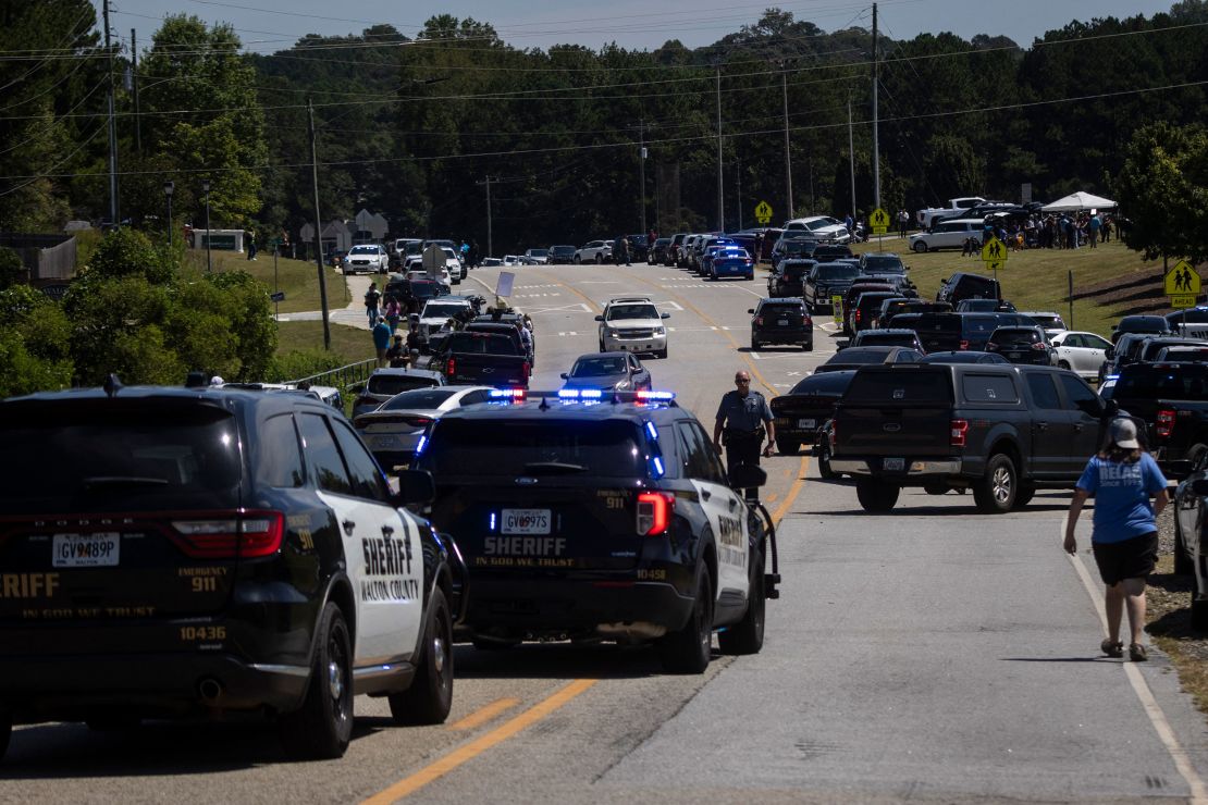 Police and first responders direct traffic after a shooting at Apalachee High School in Winder, Georgia on September 4, 2024.