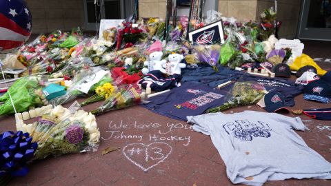 Fans build a memorial outside of Nationwide Arena in honor of Columbus Blue Jackets forward Johnny Gaudreau.