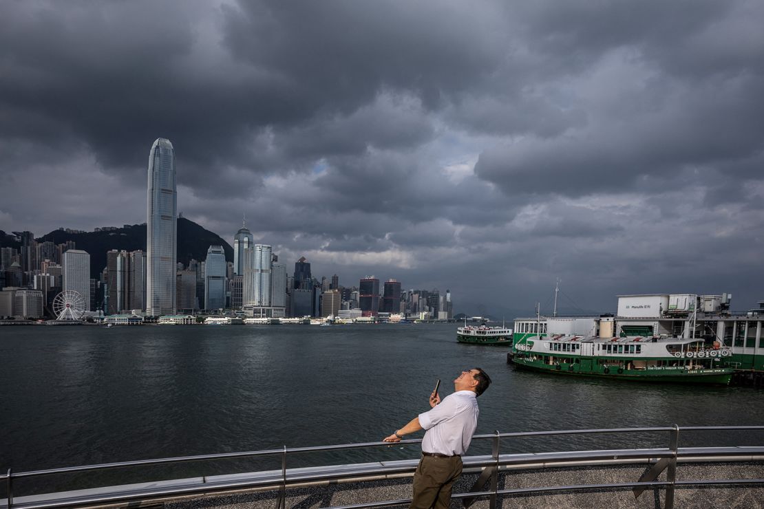 A man looks up from a promenade at Victoria Harbour in Hong Kong on September 5.