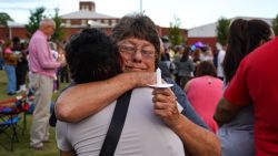 WINDER, GEORGIA - SEPTEMBER 4: (EDITOR'S NOTE: retransmission of image for improved quality) Two women embrace as students, faculty and community members gather for a vigil after a school shooting took place on September 4, 2024 in Winder, Georgia. Multiple fatalities and injuries have been reported and a suspect is in custody according to authorities.(Photo by Megan Varner/Getty Images)