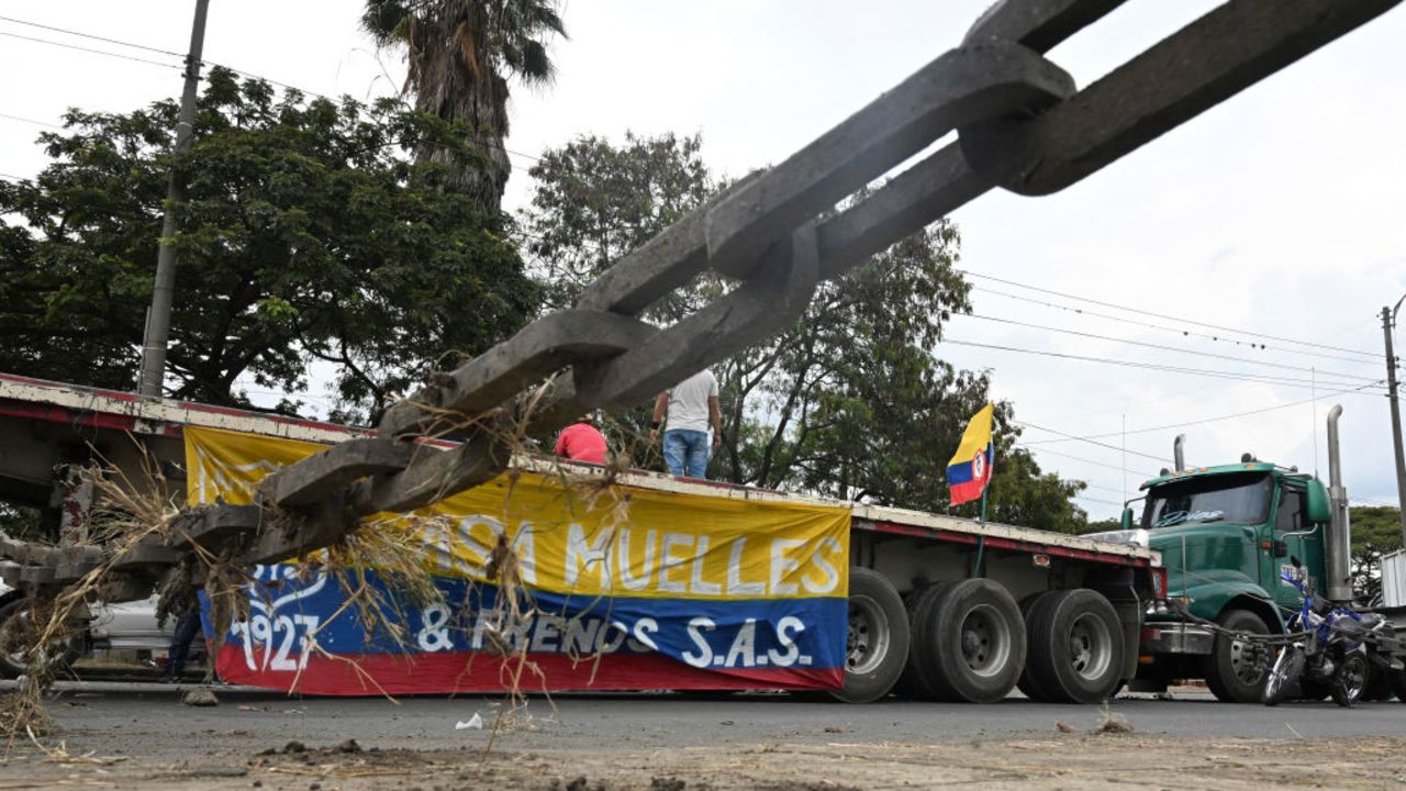 Trucks block a street during a protest against the diesel price increase in Cali, Colombia, on September 5, 2024. The Colombian government made an "urgent appeal" Wednesday to truckers blockading several highways to create safe corridors for food supplies, amid warnings of looming shortages in several cities. (Photo by JOAQUIN SARMIENTO / AFP) (Photo by JOAQUIN SARMIENTO/AFP via Getty Images)