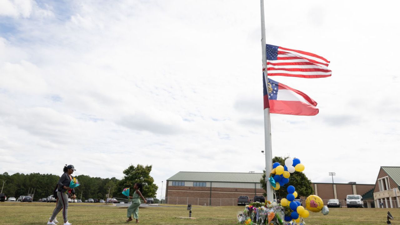 WINDER, GEORGIA - SEPTEMBER 5:  Community members visit a makeshift memorial at Apalachee High School on September 5, 2024 in Winder, Georgia. Two students and two teachers were shot and killed at the school on September 4, and a 14-year-old suspect, who is a student at the school, is in custody.  (Photo by Jessica McGowan/Getty Images)