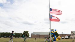 WINDER, GEORGIA - SEPTEMBER 5:  Community members visit a makeshift memorial at Apalachee High School on September 5, 2024 in Winder, Georgia. Two students and two teachers were shot and killed at the school on September 4, and a 14-year-old suspect, who is a student at the school, is in custody.  (Photo by Jessica McGowan/Getty Images)