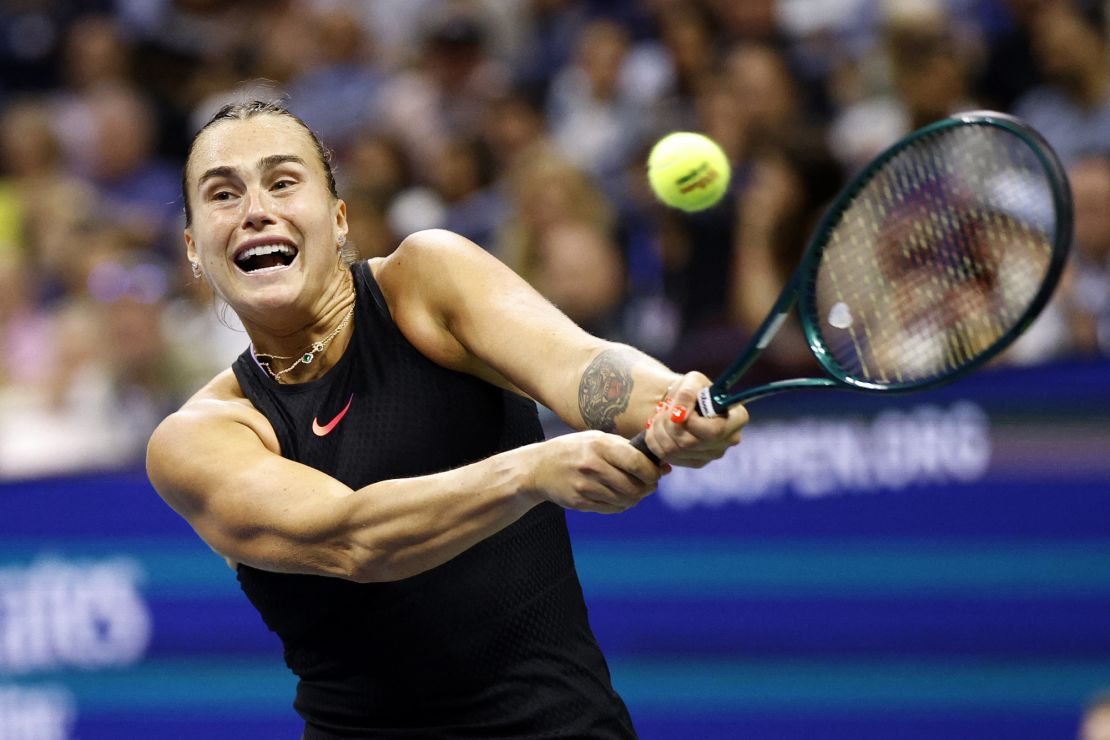 Sabalenka plays a backhand return against Navarro.