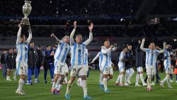 Argentina players celebrate their victory with a replica of the Copa America trophy at the end of the 2026 FIFA World Cup South American qualifiers football match between Argentina and Chile at the Mas Monumental stadium in Buenos Aires on September 5, 2024. (Photo by JUAN MABROMATA / AFP) (Photo by JUAN MABROMATA/AFP via Getty Images)