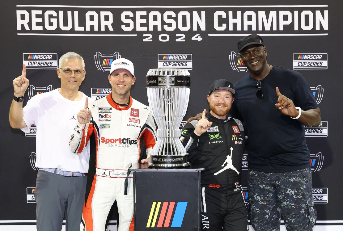 DARLINGTON, SOUTH CAROLINA – SEPTEMBER 01: 2024 Regular Season Champion Tyler Reddick, driver of the #45 Upper Deck Toyota, poses with 23XI Racing co-owner Curtis Polk, NBA Hall of Famer Michael Jordan, and driver Denny Hamlin of the #11 Sport Clips Haircuts Toyota, after the NASCAR Cup Series Cook Out Southern 500 at Darlington Raceway on September 1, 2024 in Darlington, South Carolina. (Photo by Meg Oliphant/Getty Images)