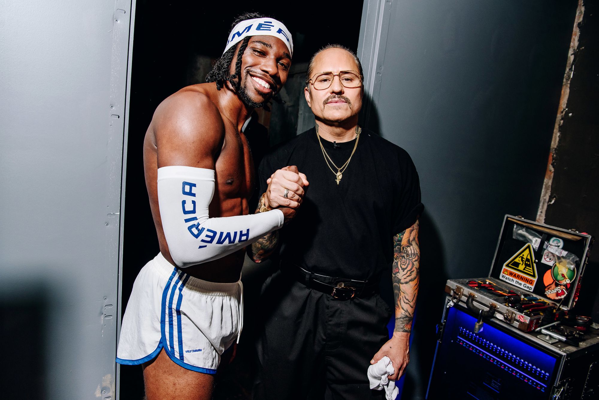 Olympian Noah Lyles and designer Willy Chavarria backstage at the Wall Street venue that hosted Chavarria’s show, “América.” The sprinter made a surprise appearance on the runway.