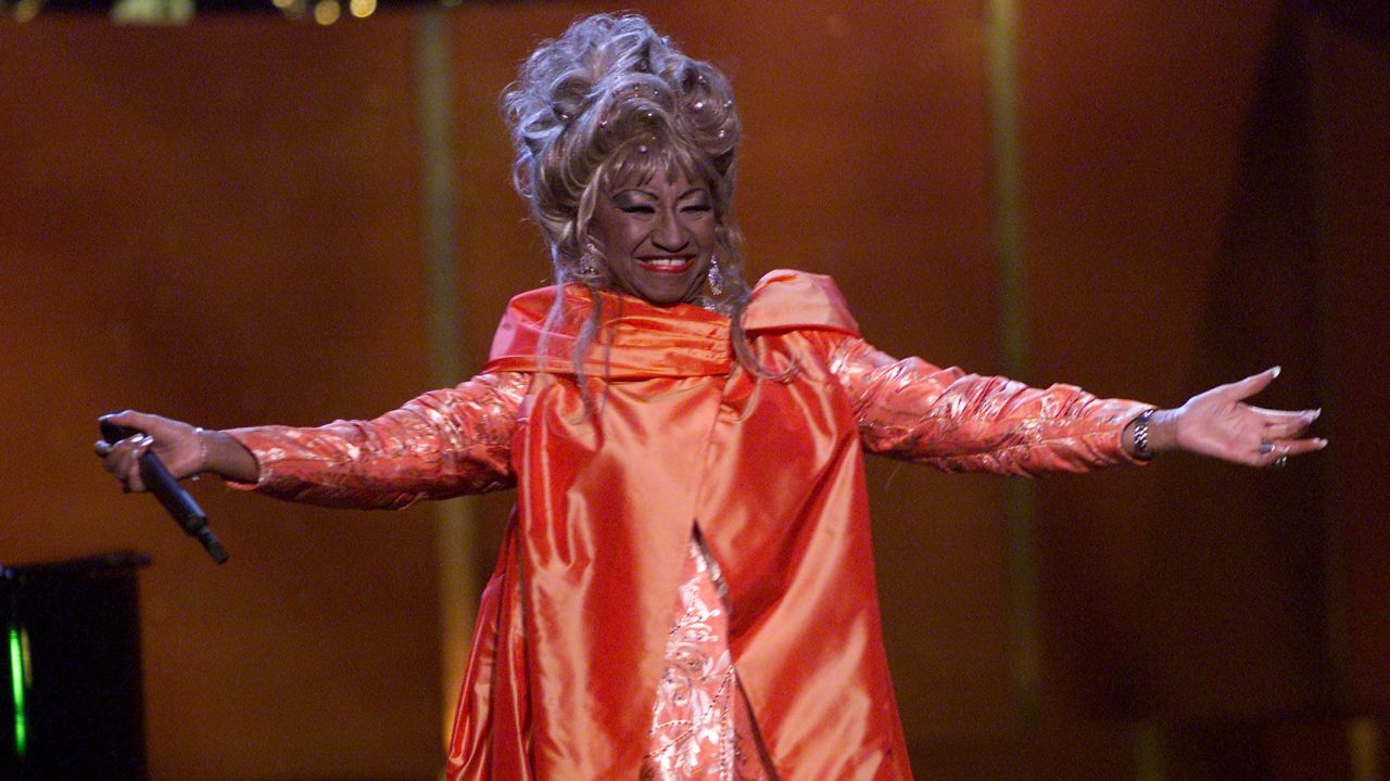 Cuban salsa singer Celia Cruz (1924 - 2003) onstage performing at 'VH1 Divas Live: The One and Only Aretha Franklin' held at Radio City Music Hall in New York City, April 10, 2001. (Photo by Scott Gries/Getty Images) 