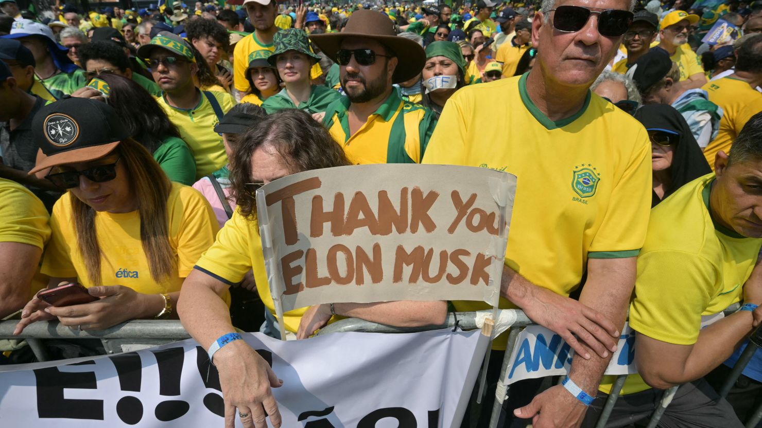 Supporters of former Brazilian President Jair Bolsonaro hold a sign thanking X social media platform owner Elon Musk, during an Independence day rally in Sao Paulo, Brazil, on September 7, 2024.