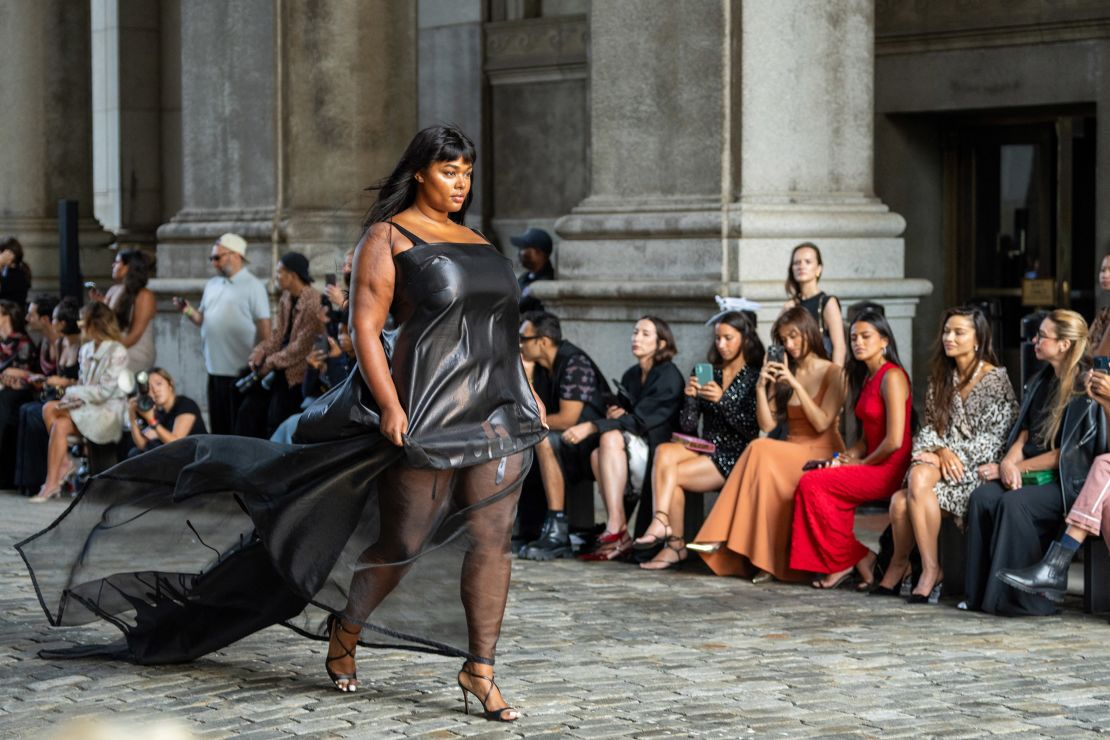 Model Precious Lee in an organza slip dress with a black drip motif. Gurung’s celebratory collection also had ties to the Hindu festival of Holi.