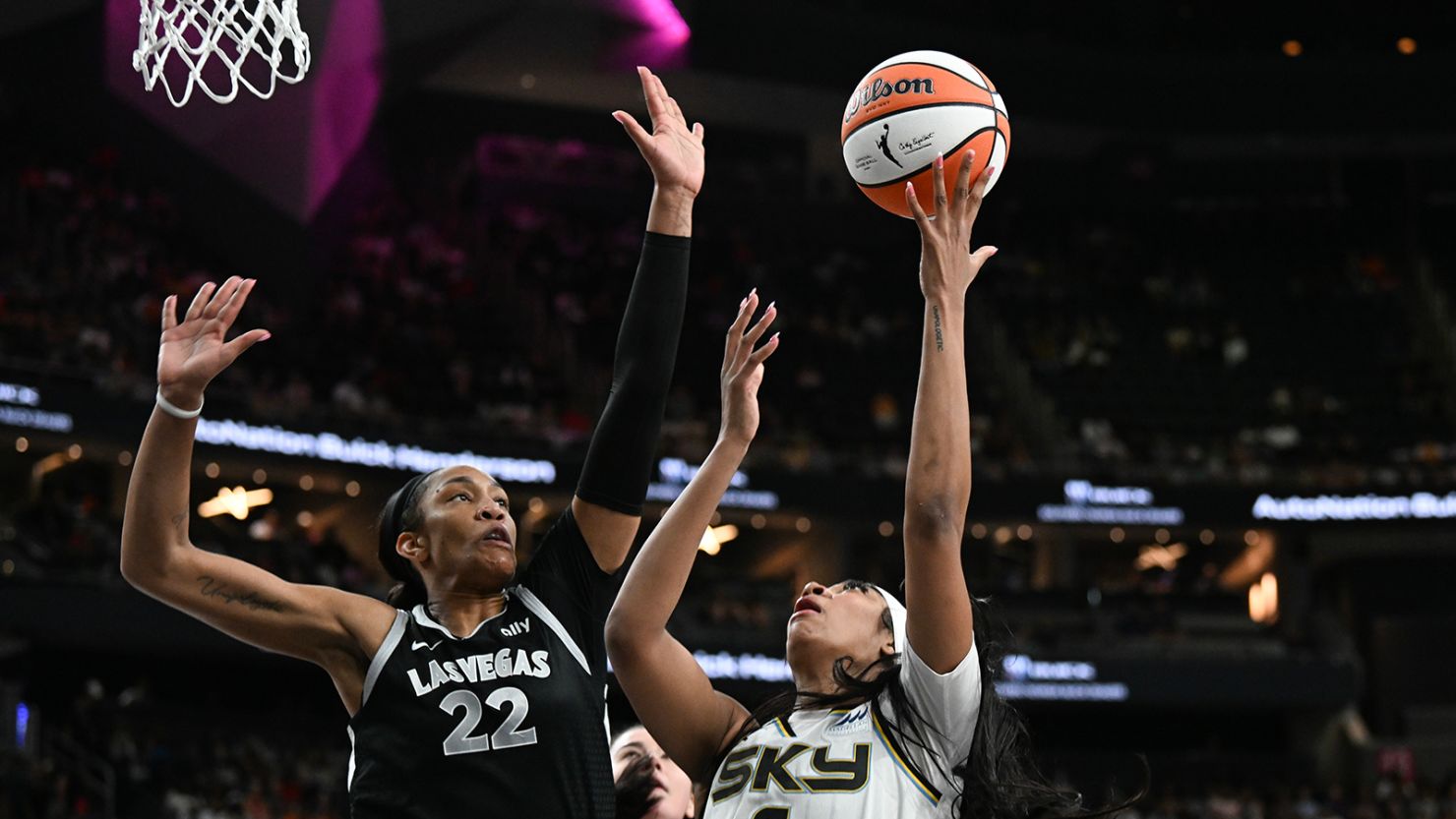 The Aces' A'ja Wilson (left) blocks a shot from Angel Reese.