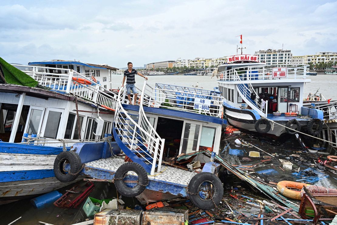 A man checks his damaged boat on September 8, 2024, after Typhoon Yagi hit Ha Long Bay, in Quang Ninh province.