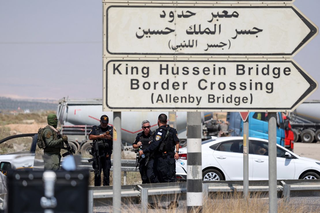 Israeli security forces are seen near the site of the shooting.