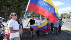 Supporters hold Venezuelan flags upon the arrival of Venezuelan opposition presidential candidate for the Plataforma Unitaria Democratica party, Edmundo Gonzalez Urrutia at Madrid's Torrejon de Ardoz military airport on September 8, 2024. Spain will "obviously" grant political asylum to Venezuelan opposition leader Edmundo Gonzalez Urrutia, Foreign Minister said on September 8, 2024. Gonzalez Urrutia left Venezuela on September 7 aboard a Spanish military aircraft after spending several days seeking refuge in the Spanish embassy in Caracas, where he fled after authorities issued an arrest warrant for him after he disputed the re-election of President Nicolas Maduro in July's election. (Photo by Thomas COEX / AFP) (Photo by THOMAS COEX/AFP via Getty Images)