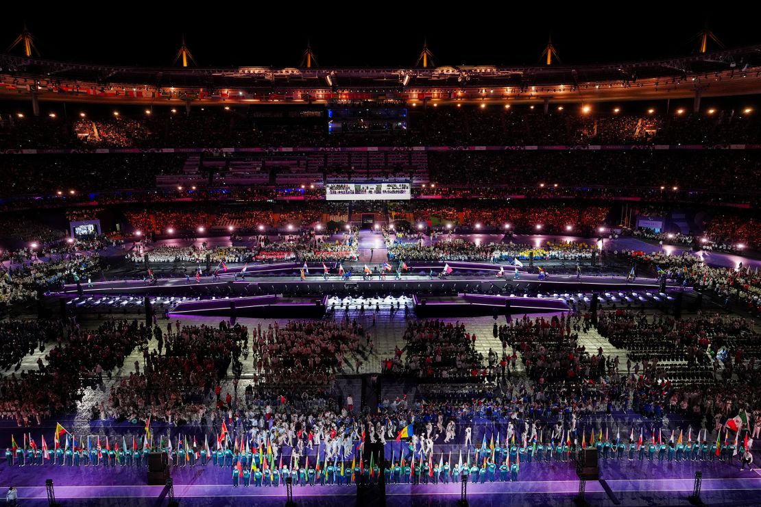 Delegations parade through the Stade de France during the closing ceremony.