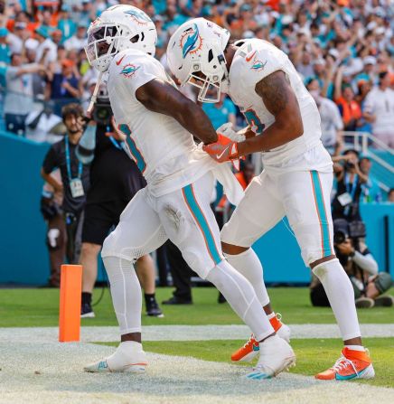 Miami Dolphins wide receivers Tyreek Hill and Jaylen Waddle celebrate a touchdown during a 20-17 victory over the Jacksonville Jaguars in Miami Gardens, Florida, on September 8. Hill was <a >detained for a short time by police</a> after a traffic incident earlier in the day. Miami-Dade Police Department Director Stephanie V. Daniels said Sunday that an investigation has begun into the incident and one of the officers involved is being placed on administrative duties.