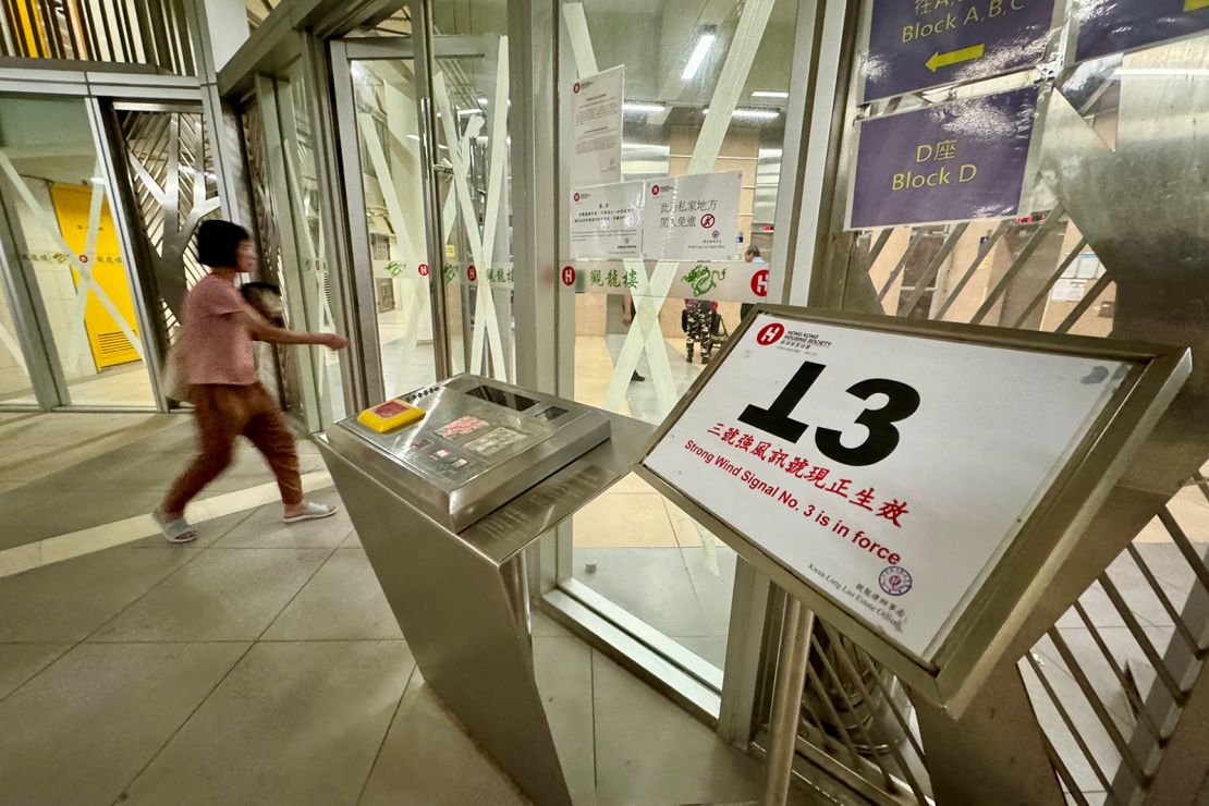 Windows and doors are taped up as Hong Kong prepares for the arrival of Typhoon Yagi.