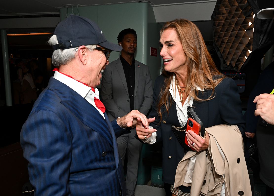 Tommy Hilfiger and Brooke Shields met shortly before Hilfiger's show, which took place in a disused Staten Island Ferry.