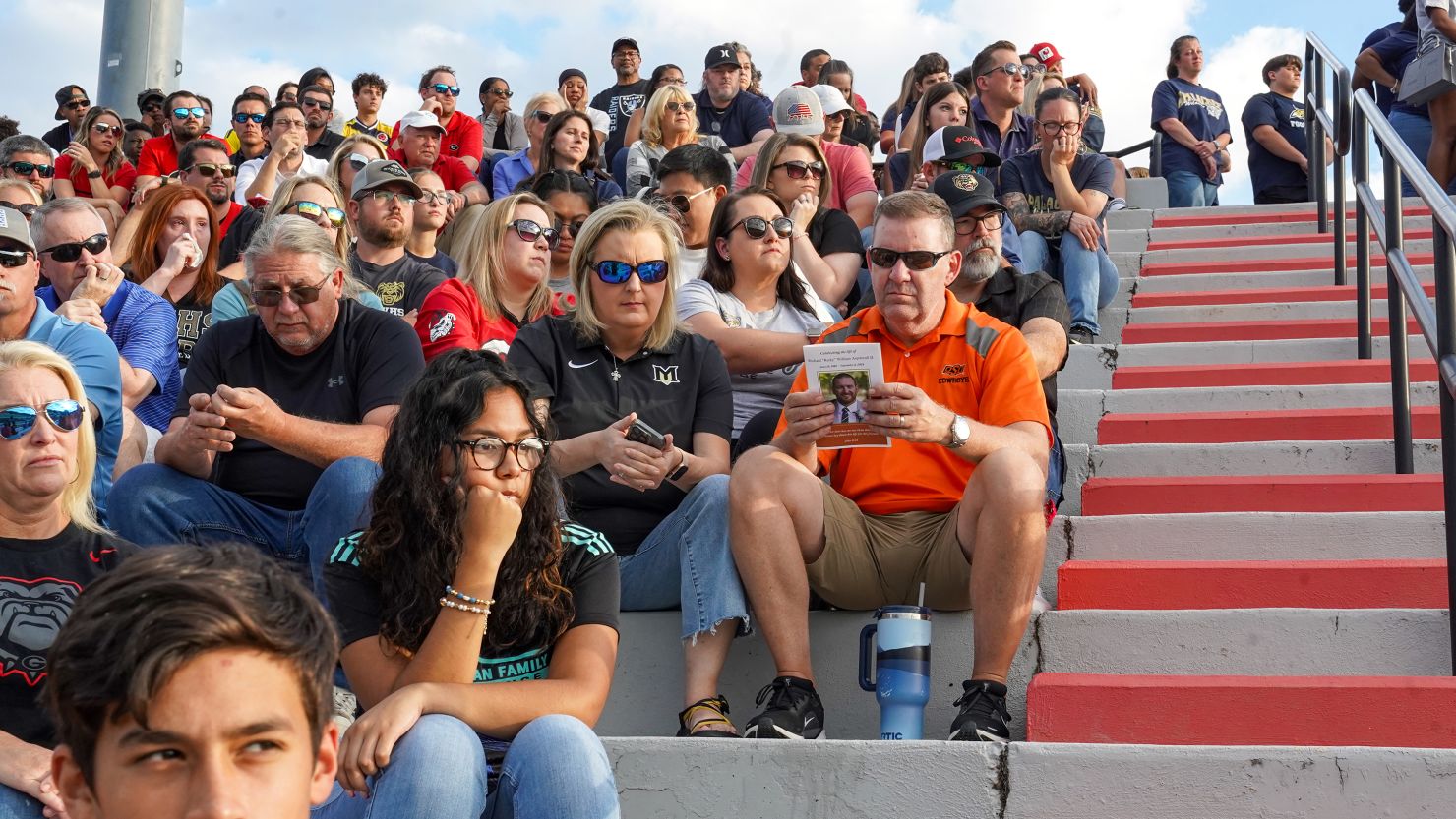 Family and friends gather for a celebration of life ceremony for Apalachee High School coach Richard Aspinwall in Flowery Branch, Georgia, on September 8.