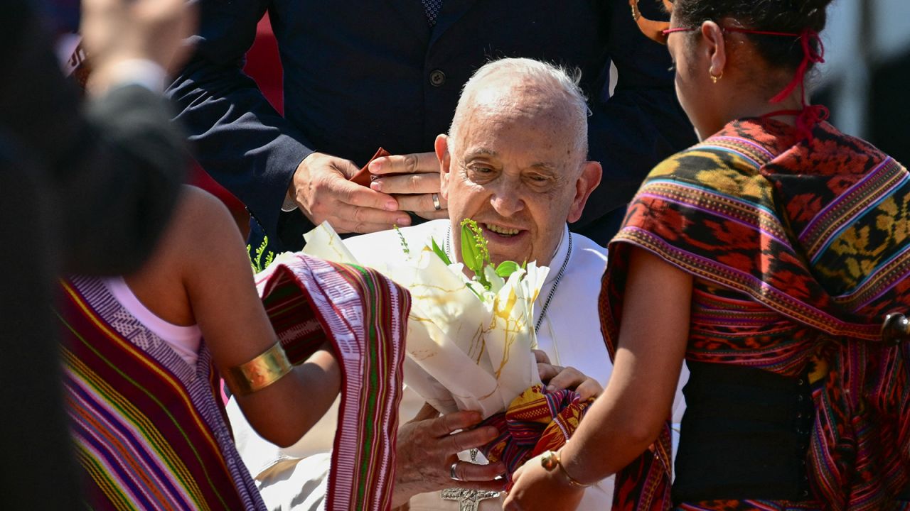 Pope Francis is greeted on his arrival at Presidente Nicolau Lobato International Airport in Dili, East Timor, on September 9.