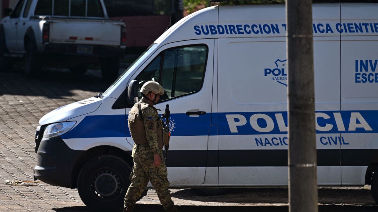 An army soldier walks next to a police van near the site of a military helicopter that crashed in Pasaquina, El Salvador on September 9, 2024. Police director and leader of the 'war' against gangs, Commissioner Mauricio Arriaza, and his companions were killed when the military helicopter they were travelling in crashed in northeastern El Salvador, the army said. (Photo by Marvin RECINOS / AFP) (Photo by MARVIN RECINOS/AFP via Getty Images)