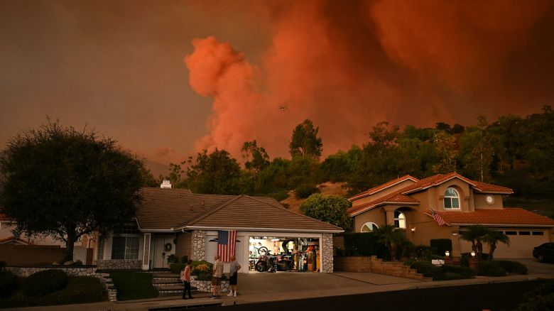 TOPSHOT - Smoke billows from the Airport Fire in Rancho Santa Margarita, California on September 9, 2024. Wildfires fueled by soaring temperatures in the western United States have scorched thousands of acres, forcing hundreds of families to flee, US officials said September 9, 2024. A blaze burning out of a control near Los Angeles sparked mandatory evacuations as it tore through swathes of tinder-dry California countryside around popular tourist spots. (Photo by Patrick T. Fallon / AFP) (Photo by PATRICK T. FALLON/AFP via Getty Images)