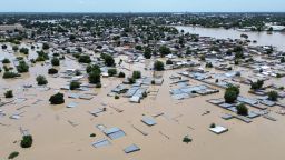 This aerial view shows houses submerged under water in Maiduguri on September 10, 2024.