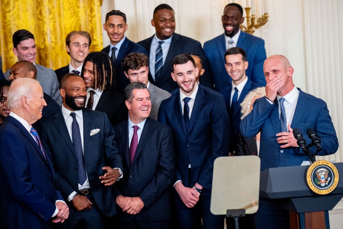 University of Connecticut men's basketball head coach Dan Hurley covers his mouth after cursing during the team's title celebration in the East Room of the White House.