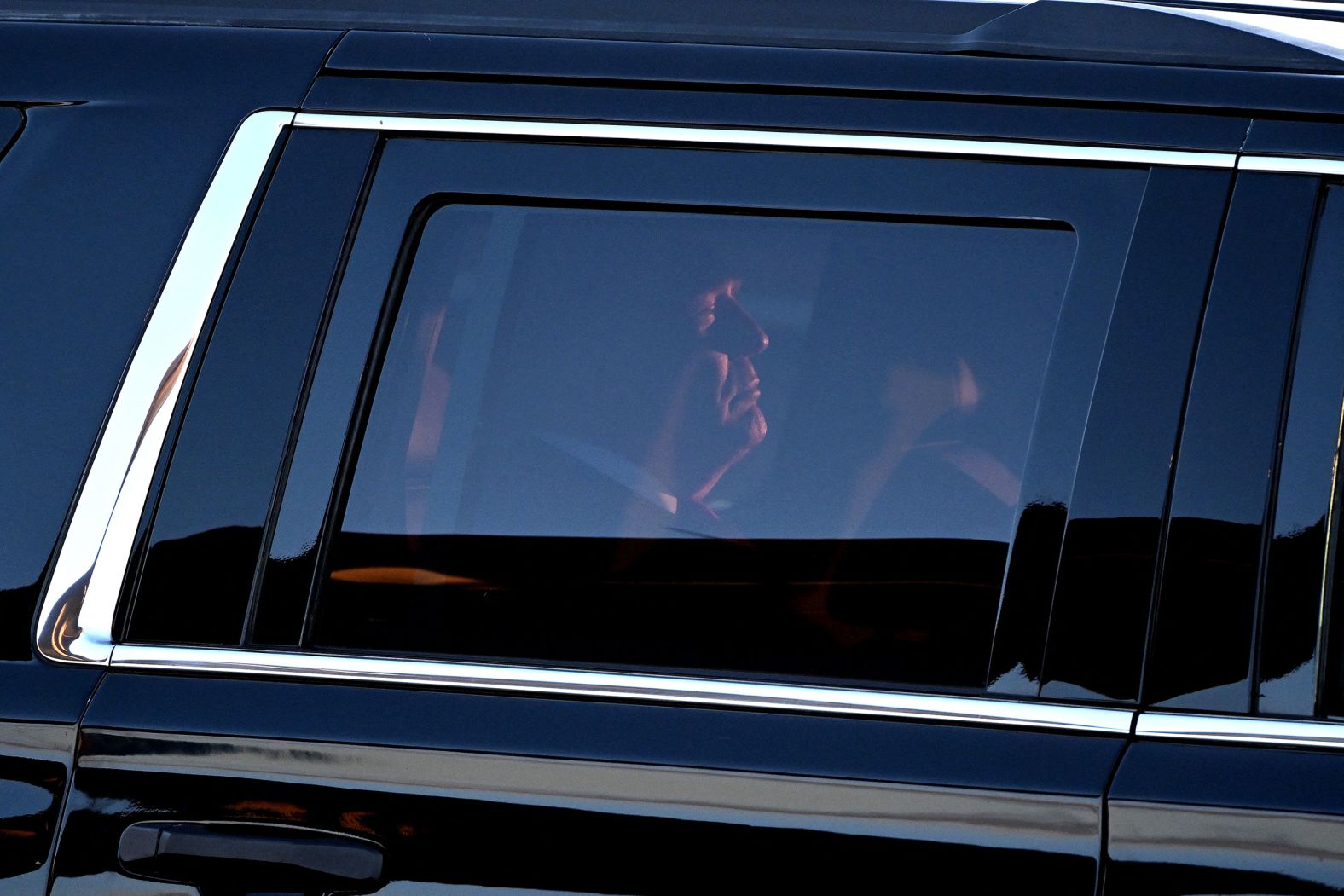 Trump rides in a car after arriving at the Philadelphia International Airport on Tuesday.