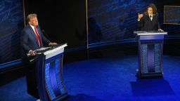 US Vice President and Democratic presidential candidate Kamala Harris speaks as former US President and Republican presidential candidate Donald Trump listens during a presidential debate at the National Constitution Center in Philadelphia, Pennsylvania, on September 10, 2024. (Photo by SAUL LOEB / AFP) (Photo by SAUL LOEB/AFP via Getty Images)