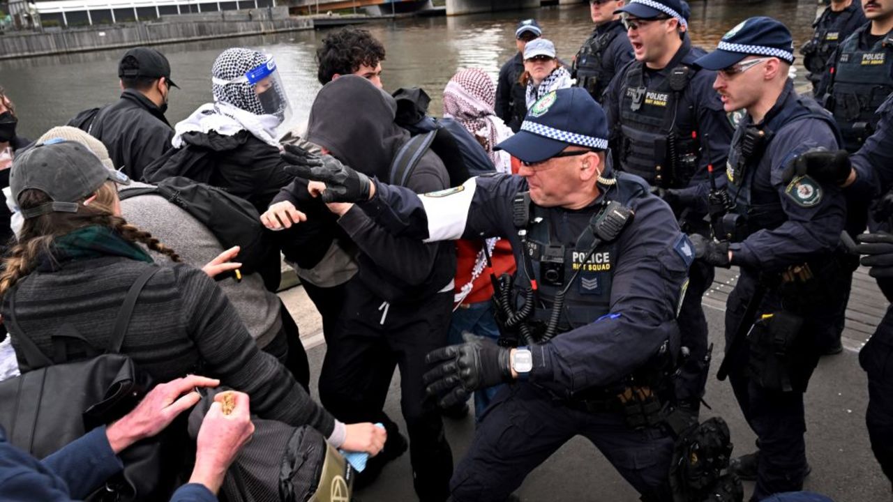 Protesters confront police outside the Land Forces 2024 arms fair in Melbourne on September 11, 2024. (Photo by William WEST / AFP) (Photo by WILLIAM WEST/AFP via Getty Images)