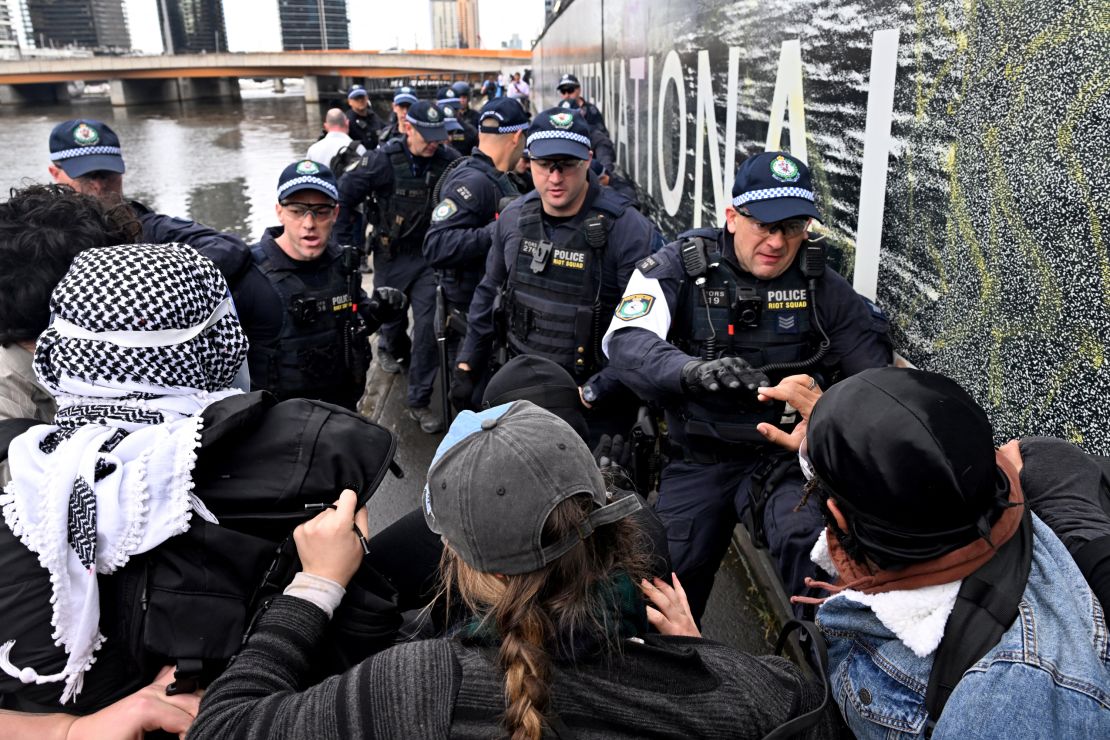 Protesters confront police outside the Land Forces 2024 arms fair in Melbourne on September 11, 2024.