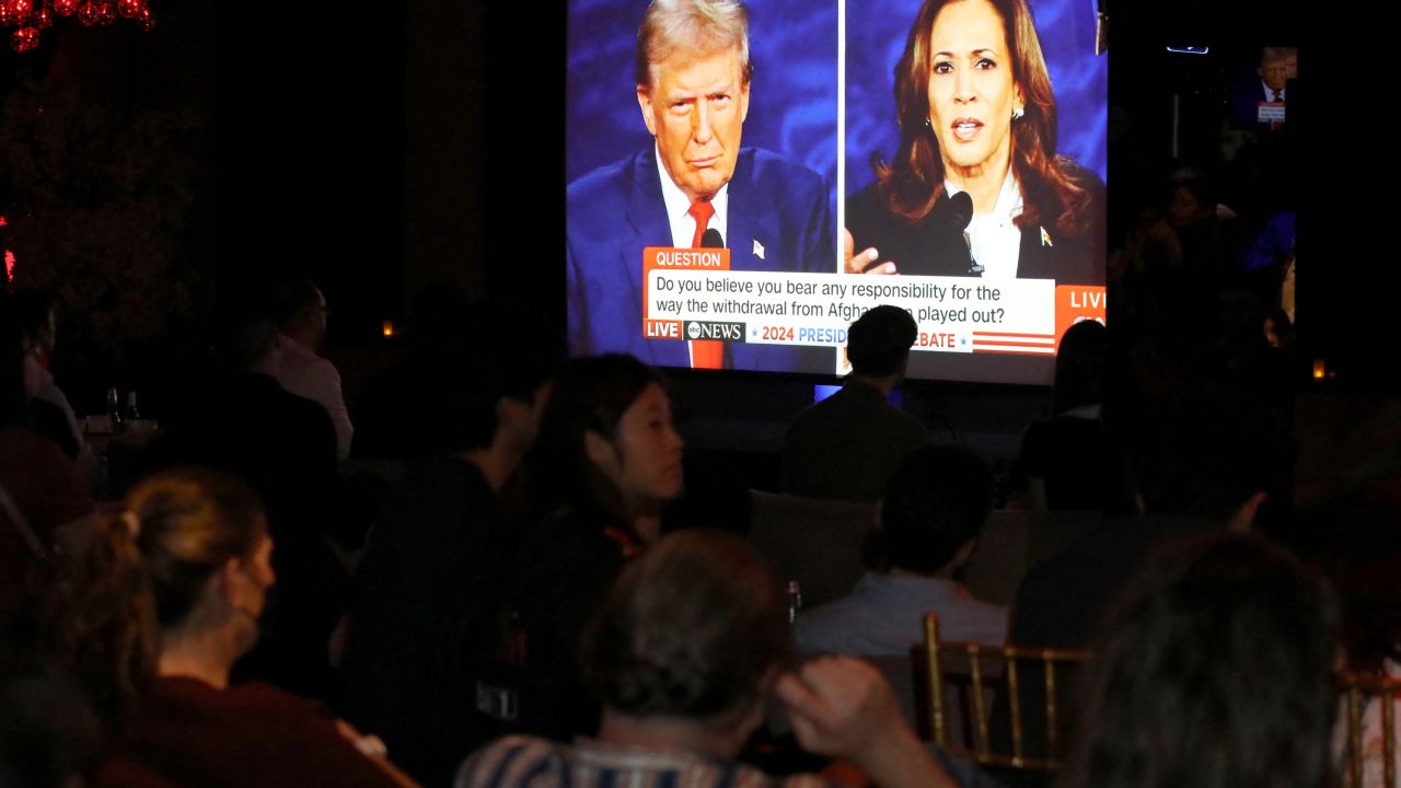 TOPSHOT - People attend a watch party for the US Presidential debate between Vice President and Democratic presidential candidate Kamala Harris and former US President and Republican presidential candidate Donald Trump in New York on September 10, 2024. (Photo by Leonardo Munoz / AFP) (Photo by LEONARDO MUNOZ/AFP via Getty Images)