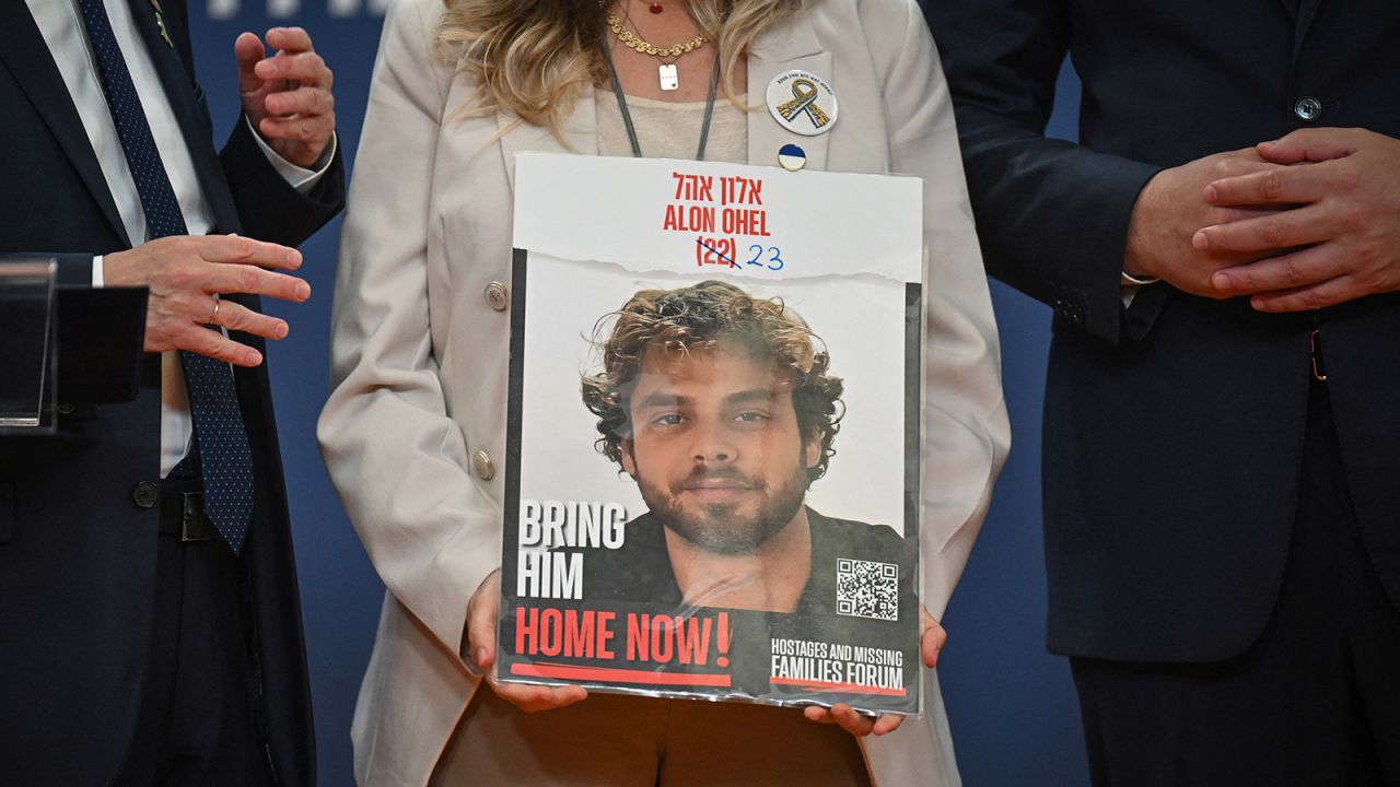 Idit Ohel, mother of Israeli-Serbian citizen Alon Ohel, who is being held hostage in Gaza by Hamas, holds the portrait of her son during a press conference in Belgrade, Serbia, on September 11.