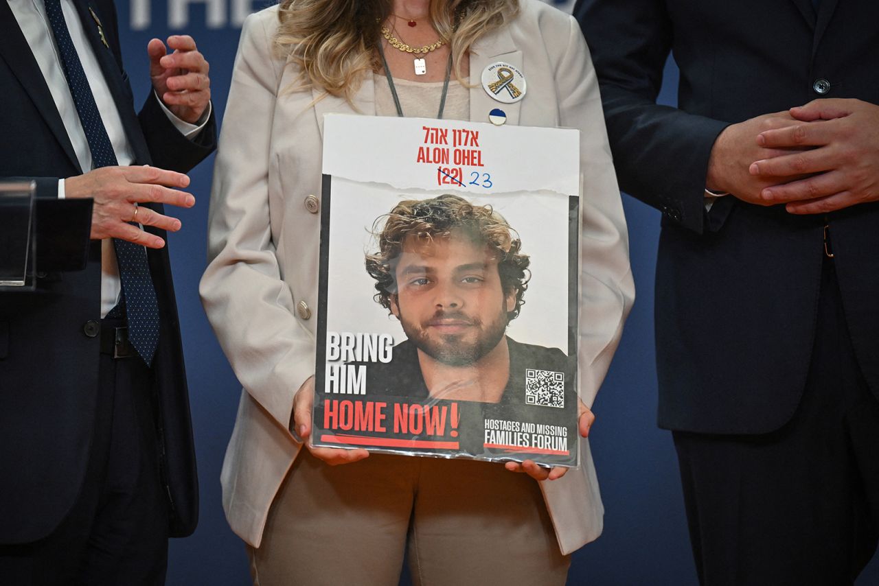 Idit Ohel, mother of Israeli-Serbian citizen Alon Ohel, who is being held hostage in Gaza by Hamas, holds the portrait of her son during a press conference in Belgrade, Serbia, on September 11.