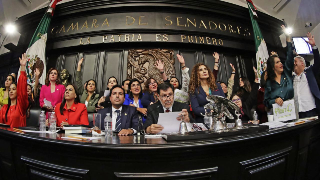 Ruling Morena Party senator Gerardo Fernandez Norona (C) and members of Mexico's Senate celebrate after they passed the controversial judicial reform at the Senate's chamber in Mexico City on September 11, 2024. Mexico became the world's first country to allow voters to elect judges at all levels on Wednesday, after protesters invaded the upper house and suspended debate on the issue. (Photo by Cesar Sanchez / AFP) (Photo by CESAR SANCHEZ/AFP via Getty Images)