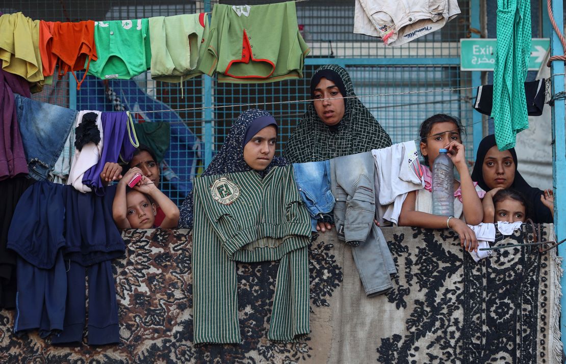 Displaced Palestinians take shelter at a UN school and watch after an Israeli air strike hits the site in Nuseirat, Gaza Strip, on September 11, 2024, amid the ongoing war in the Palestinian territory between Israel and Hamas.