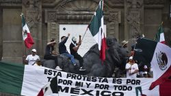 Members of the National Association of Magistrates and District Judges take part in a protest after the approval by the Senate of the judicial reform proposed by the government at the Angel de la Independencia roundabout in Mexico City on September 11, 2024. Mexico will be the first country in the world to elect all its judges by popular vote after the approval of a reform by leftist President Andrés Manuel López Obrador that, according to his detractors, fulminates the independence of powers. (Photo by Rodrigo Oropeza / AFP) (Photo by RODRIGO OROPEZA/AFP via Getty Images)