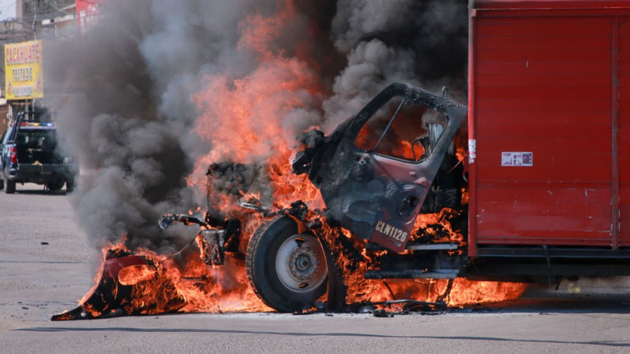 A truck on fire is seen on the streets of Culiacan, Sinaloa State, Mexico, on September 11, 2024. Elements of Mexico's National Guard were deployed in the state of Sinaloa, in the northwest of the country, amid an escalation of violence that authorities attribute to internal struggles within the Sinaloa cartel following the capture of its leader, Ismael 