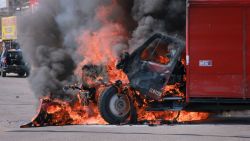 A truck on fire is seen on the streets of Culiacan, Sinaloa State, Mexico, on September 11, 2024. Elements of Mexico's National Guard were deployed in the state of Sinaloa, in the northwest of the country, amid an escalation of violence that authorities attribute to internal struggles within the Sinaloa cartel following the capture of its leader, Ismael "Mayo" Zambada. (Photo by Ivan MEDINA / AFP) (Photo by IVAN MEDINA/AFP via Getty Images)