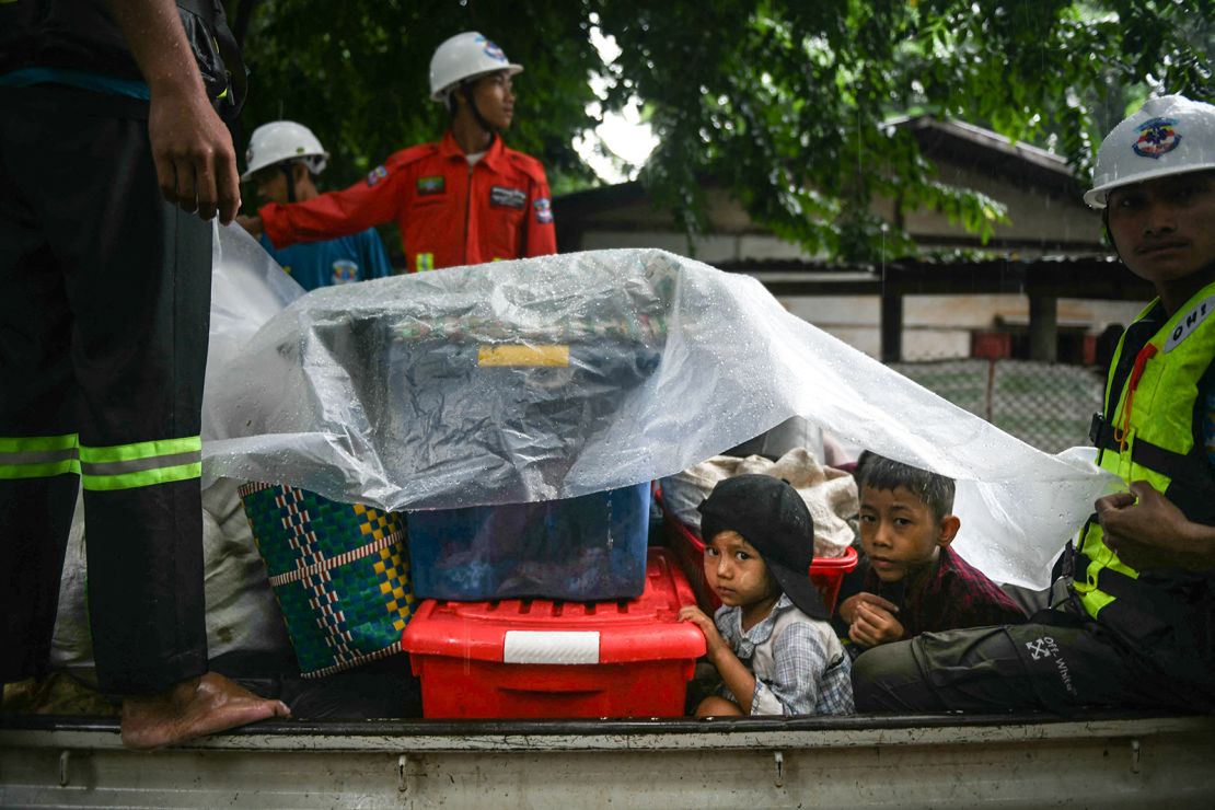 Children evacuated on boats as floods engulf Myanmar's Bago region on September 12, 2024.