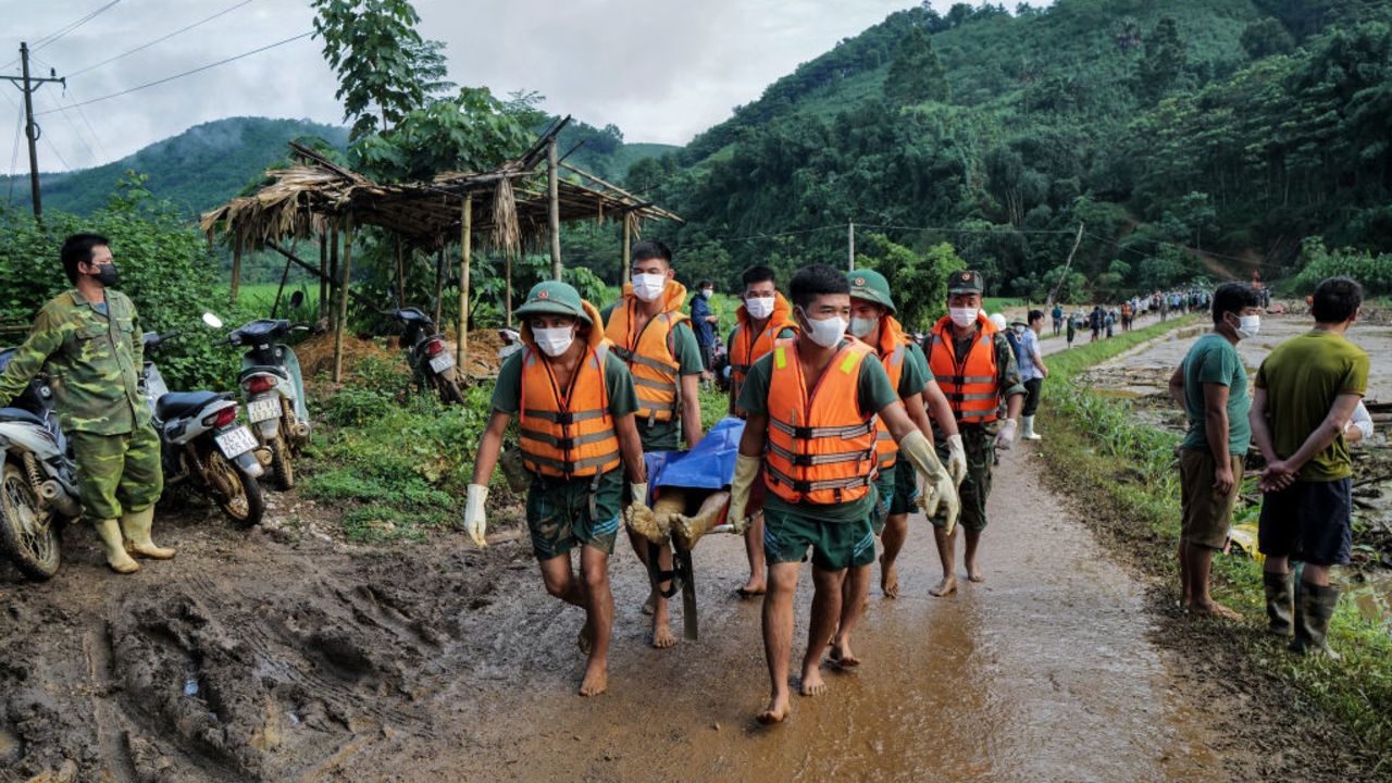 EDITORS NOTE: Graphic content / Rescue officials carry the body of a victim of a landslide in the remote mountainous village of Lang Nu, in Lao Cai province on September 12, 2024, in the aftermath of Typhoon Yagi hitting northern Vietnam. Millions of people across Southeast Asia struggled on September 12 with flooded homes, power cuts and wrecked infrastructure after Typhoon Yagi swept through the region, as the death toll passed 200. (Photo by AFP) (Photo by STR/AFP via Getty Images)