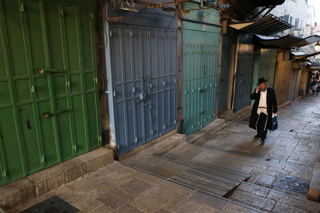 A Jewish man walks past closed shops in Jerusalem's Old City on September 11, 2024.