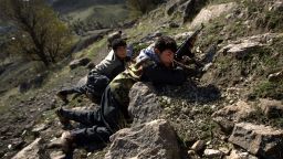 TOPSHOT - PKK guerillas take positions during a patrol through a mountain pass along the Iraq-Iran border in the mountains of northern Iraq's Kurdish autonomous region, 20 November 2006.  The fog-choked mountainous border region between Turkey, Iran and Iraq is home to the guerillas of the Kurdistan Workers' Party (PKK) struggling for a solution to the long simmering question of a Kurdish homeland. 
AFP PHOTO/DAVID FURST (Photo by DAVID FURST / AFP) (Photo by DAVID FURST/AFP via Getty Images)