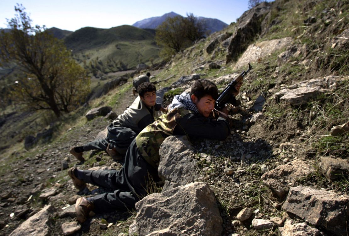 PKK guerillas take positions during a patrol through a mountain pass along the Iraq-Iran border in the mountains of northern Iraq's Kurdish autonomous region on November 20, 2006.